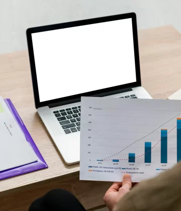 man-working-his-laptop-with-infographics-indoors